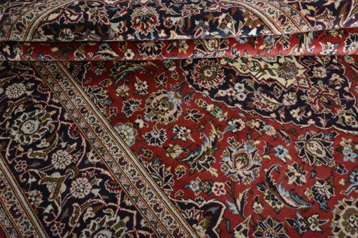 Close-up detail of 2000s Kashan rug from Iran / Persia showing Wool weave
