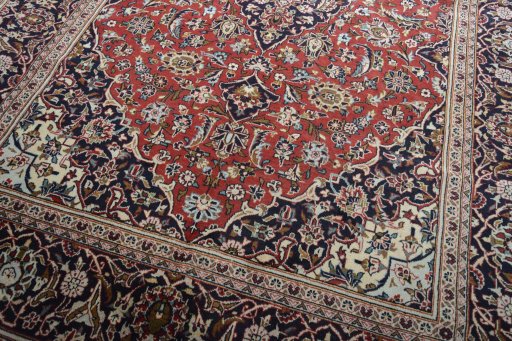 Close-up detail of 2000s Kashan rug from Iran / Persia showing Wool weave