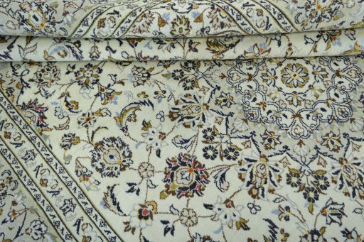 Close-up detail of 2000s Kashan rug from Iran / Persia showing Wool weave
