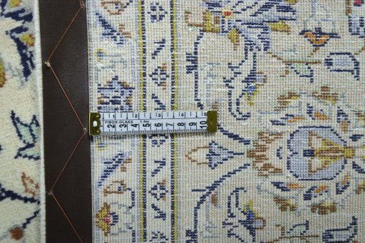 Backside of handmade 2000s Kashan rug showing knot structure and weave density
