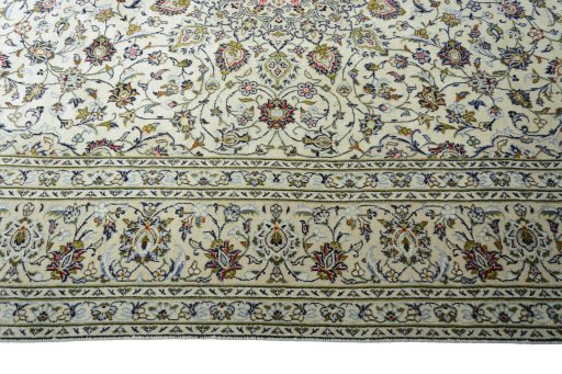 Corner detail of 2000s Kashan rug showing border pattern and Wool pile