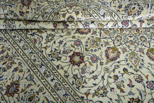 Close-up detail of 2000s Kashan rug from Iran / Persia showing Wool weave