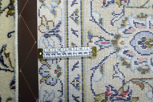Backside of handmade 2000s Kashan rug showing knot structure and weave density