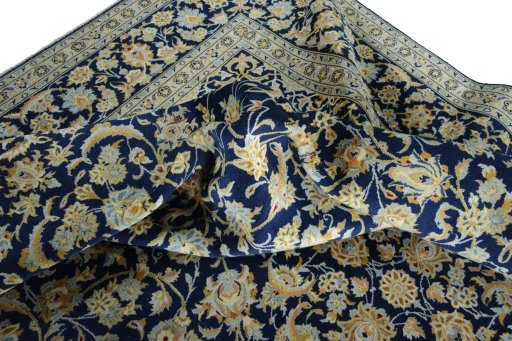Surface texture of 2000s Kashan rug with natural Wool and intricate pattern