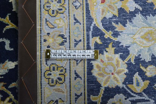 Backside of handmade 2000s Kashan rug showing knot structure and weave density