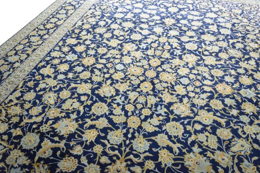 Backside of handmade 2000s Kashan rug showing knot structure and weave density