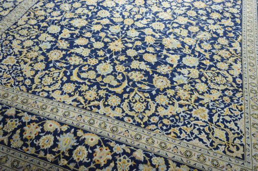 Close-up detail of 2000s Kashan rug from Iran / Persia showing Wool weave