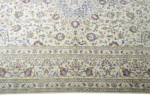 Corner detail of 2000s Kashan rug showing border pattern and Wool pile