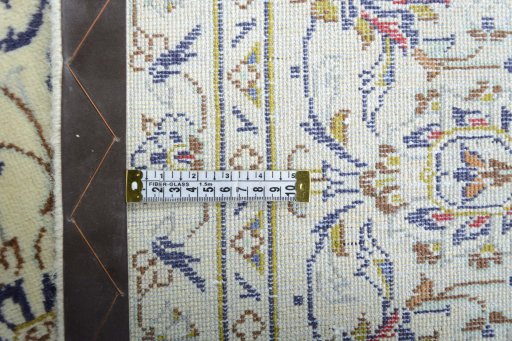 Backside of handmade 2000s Kashan rug showing knot structure and weave density