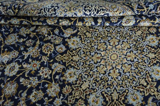 Close-up detail of 2000s Kashan rug from Iran / Persia showing Wool weave