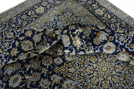 Surface texture of 2000s Kashan rug with natural Wool and intricate pattern