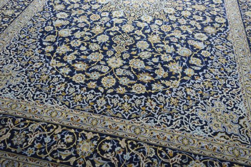 Close-up detail of 2000s Kashan rug from Iran / Persia showing Wool weave