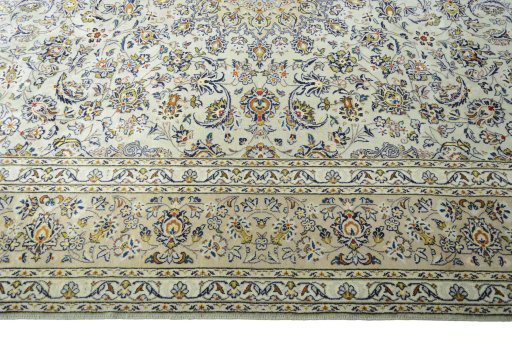 Corner detail of 2000s Kashan rug showing border pattern and Wool pile