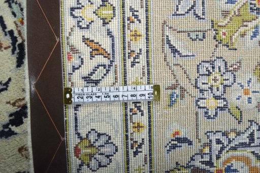 Backside of handmade 2000s Kashan rug showing knot structure and weave density
