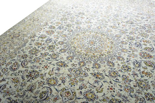 Backside of handmade 2000s Kashan rug showing knot structure and weave density
