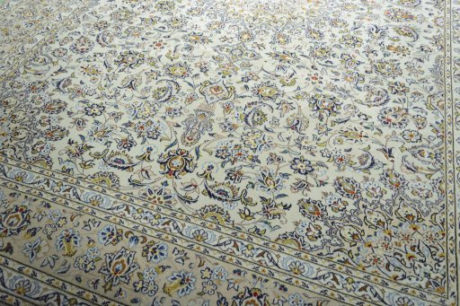 Close-up detail of 2000s Kashan rug from Iran / Persia showing Wool weave