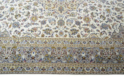 Corner detail of 2000s Kashan rug showing border pattern and Wool pile