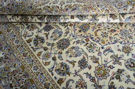 Close-up detail of 2000s Kashan rug from Iran / Persia showing Wool weave