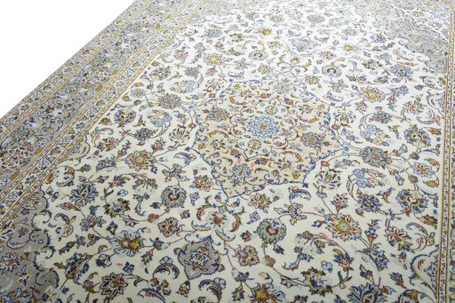 Backside of handmade 2000s Kashan rug showing knot structure and weave density
