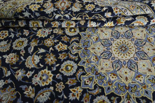 Close-up detail of 2000s Kashan rug from Iran / Persia showing Wool weave