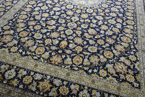 Close-up detail of 2000s Kashan rug from Iran / Persia showing Wool weave