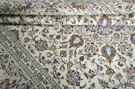 Close-up detail of 2000s Kashan rug from Iran / Persia showing Wool weave