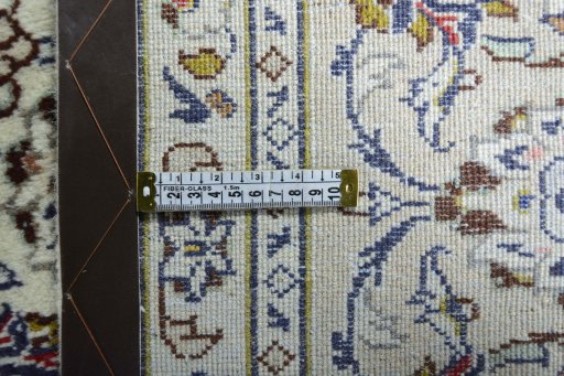 Backside of handmade 2000s Kashan rug showing knot structure and weave density