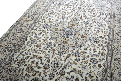 Backside of handmade 2000s Kashan rug showing knot structure and weave density