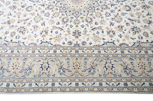 Corner detail of New Kashan rug showing border pattern and Wool pile
