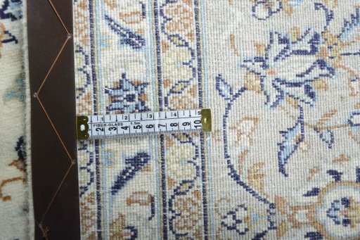 Backside of handmade New Kashan rug showing knot structure and weave density