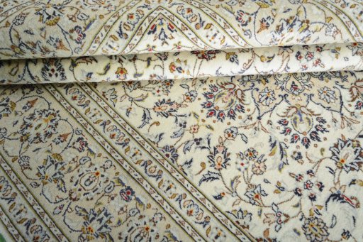 Close-up detail of 2000s Kashan rug from Iran / Persia showing Wool weave