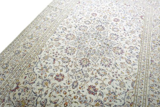 Backside of handmade 2000s Kashan rug showing knot structure and weave density