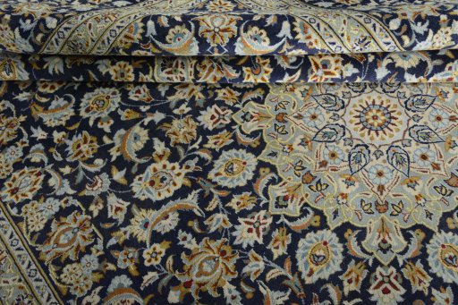 Close-up detail of 2000s Kashan rug from Iran / Persia showing Wool weave