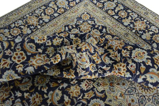 Surface texture of 2000s Kashan rug with natural Wool and intricate pattern