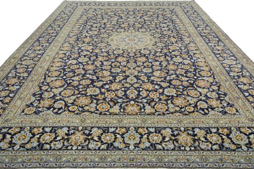 Surface texture of 2000s Kashan rug with natural Wool and intricate pattern