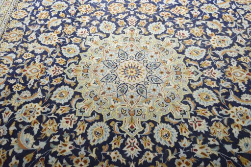 Central medallion detail of 2000s Kashan rug from Iran / Persia