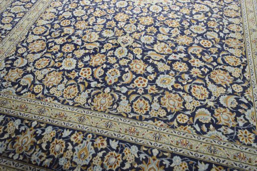 Close-up detail of 2000s Kashan rug from Iran / Persia showing Wool weave