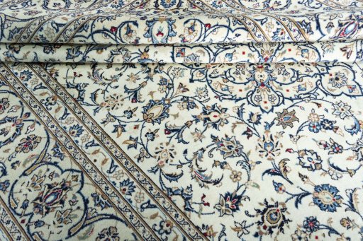 Close-up detail of 2000s Kashan rug from Iran / Persia showing Wool weave