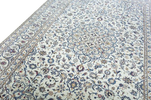 Backside of handmade 2000s Kashan rug showing knot structure and weave density