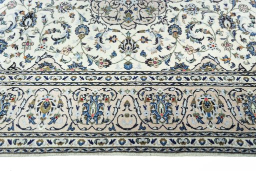 Corner detail of New Kashan rug showing border pattern and Wool pile