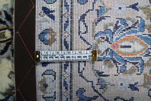 Backside of handmade New Kashan rug showing knot structure and weave density