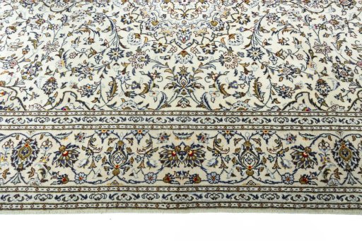 Corner detail of 2000s Kashan rug showing border pattern and Wool pile