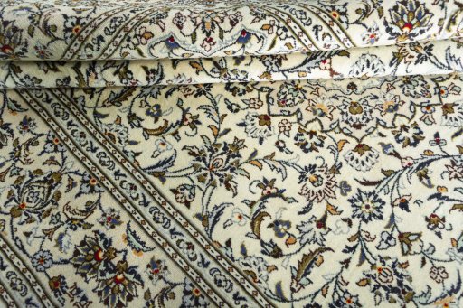 Close-up detail of 2000s Kashan rug from Iran / Persia showing Wool weave