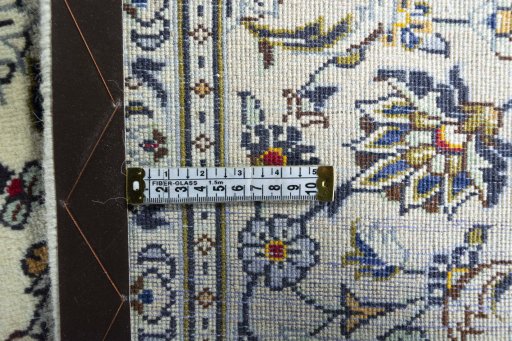 Backside of handmade 2000s Kashan rug showing knot structure and weave density