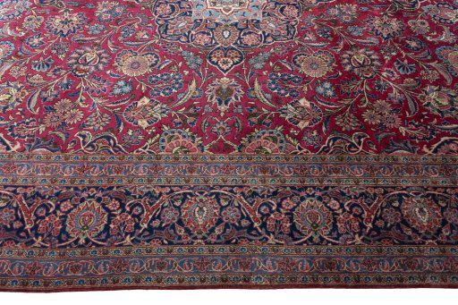 Corner detail of 1930s Kashan rug showing border pattern and Cork pile