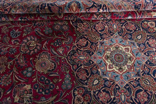 Surface texture of 1930s Kashan rug with natural Cork and intricate pattern