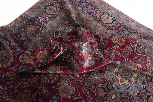 Backside of handmade 1930s Kashan rug showing knot structure and weave density