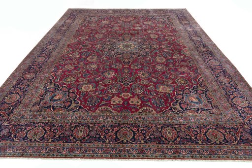 Surface texture of 1930s Kashan rug with natural Cork and intricate pattern