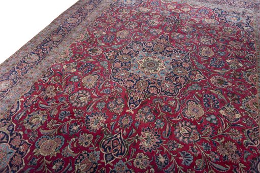 Backside of handmade 1930s Kashan rug showing knot structure and weave density