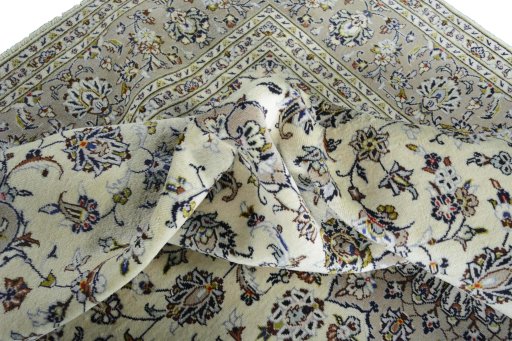 Surface texture of 2000s Kashan rug with natural Wool and intricate pattern
